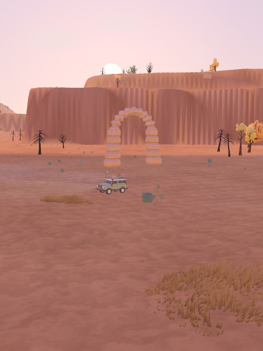 Red Canyon: a stone arch below red mesas, the truck parked in front.
