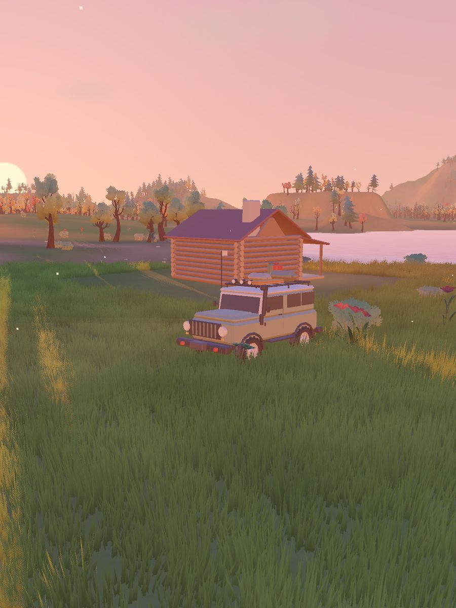 Golden Valley at sunset: the truck parked by a log cabin on the lake shore.